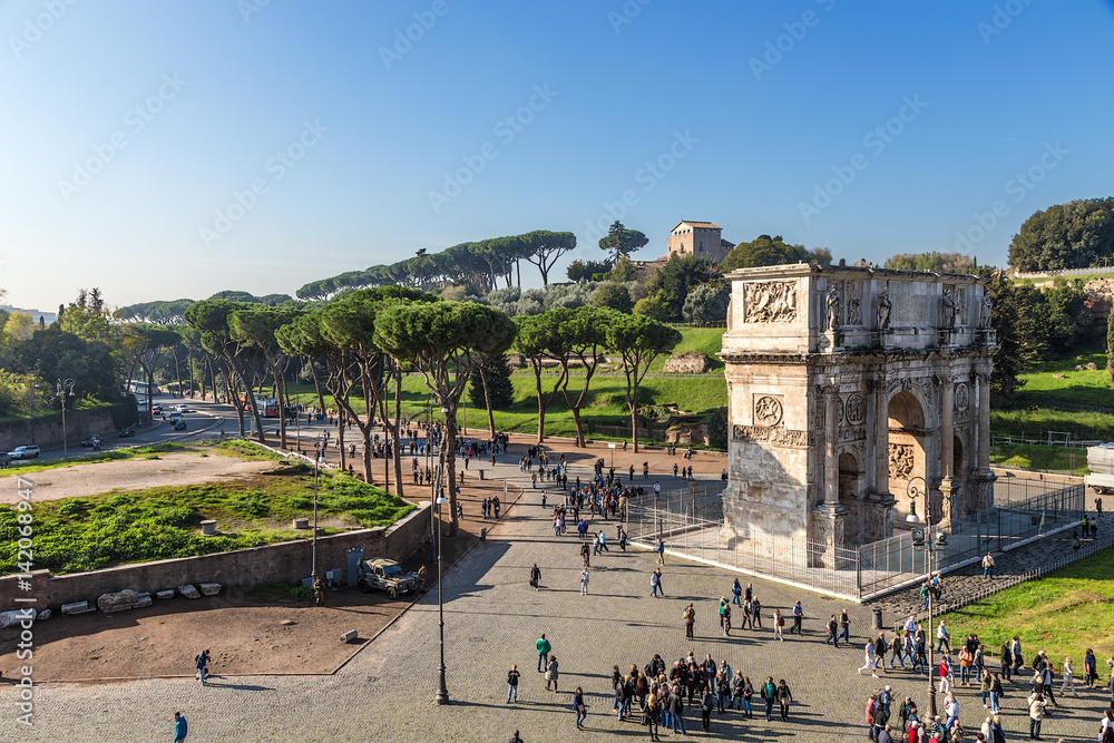 Rome, Italy. The triumphal arch of Constantine (315) against the backdrop of Palatine Hill and the Church of San Bonaventura