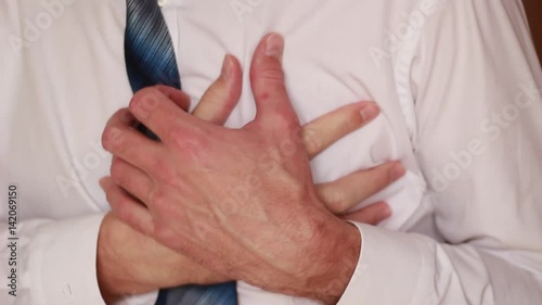 Sudden chest attack with businessman