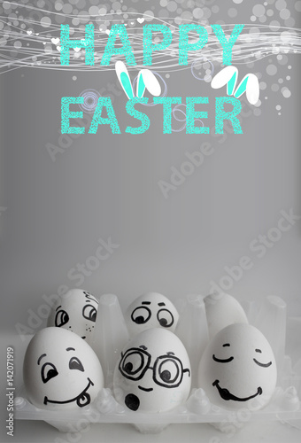 Eggs in a box with faces painted photo