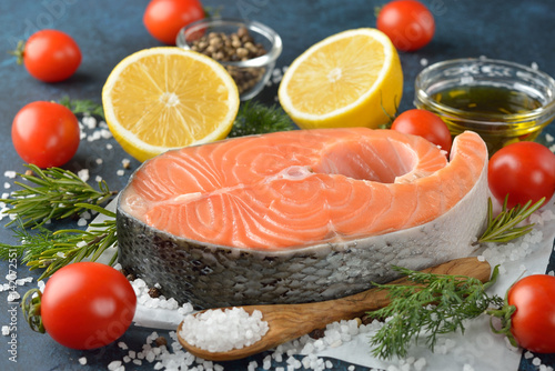 Raw salmon steak and ingredients