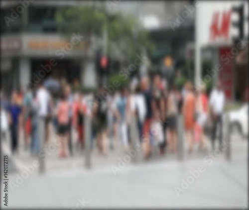 Wallpaper Mural Many blurred people on the sidewalk and cross the street in a shopping area in the downtown of Orchard Road in Singapore. Torontodigital.ca