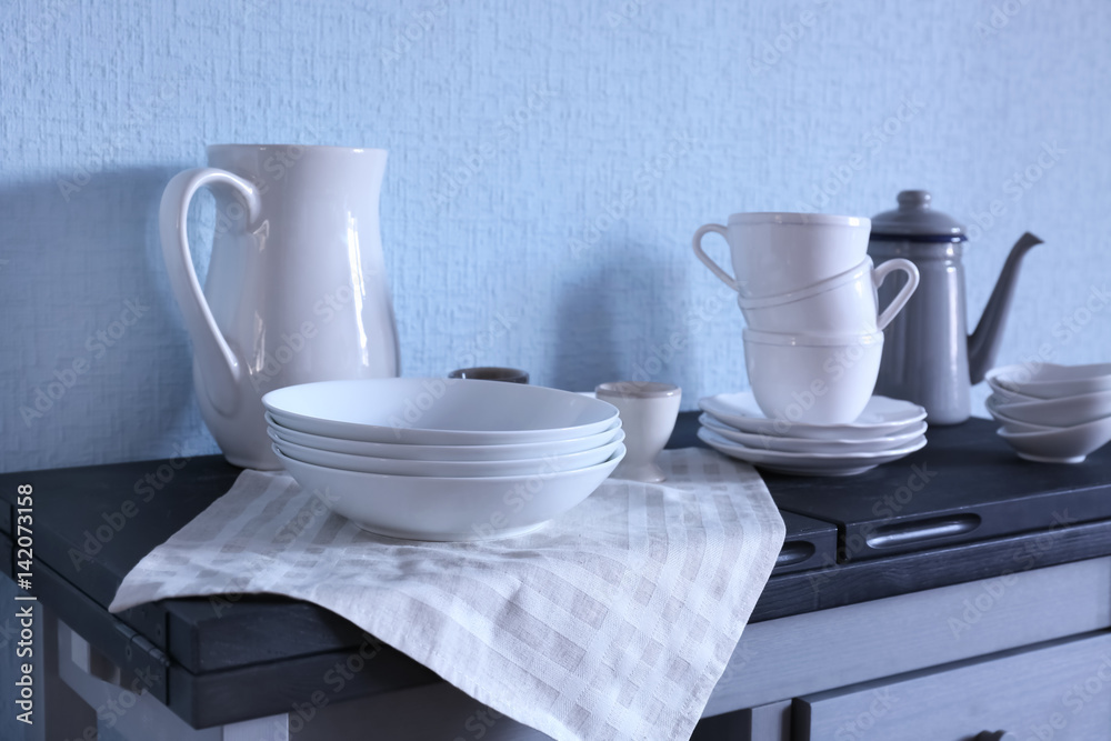 Different dishware on kitchen table Different dishware on kitchen table