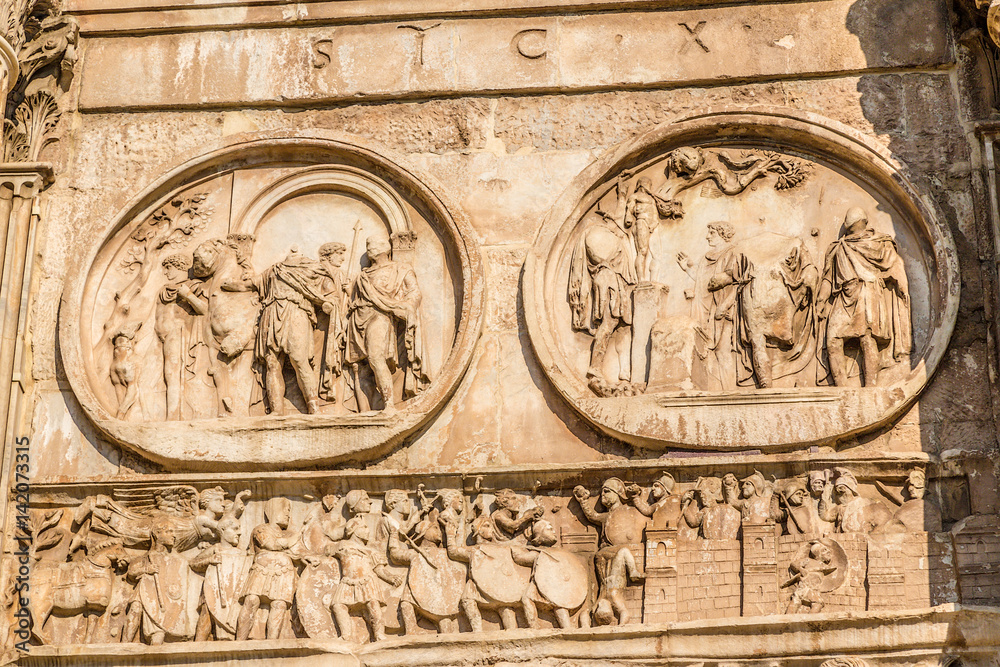 Rome. Arch of Constantine. To the left - a medallion  - emperor's departure for hunting, to the right - 