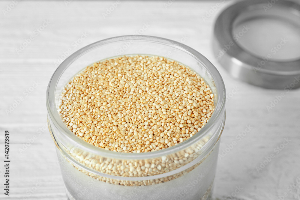 Organic quinoa seeds in glass jar, closeup Organic quinoa seeds in glass jar, closeup