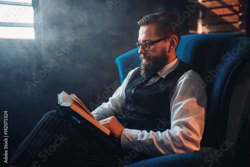 Man in glasses against window in smoky room