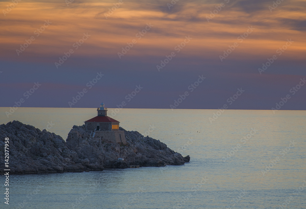 Fototapeta premium Lighthouse in sunset; island Grebeni, Dubrovnik, Croatia