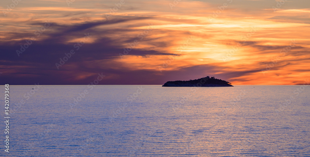 Sunset over Sveti Andrija island near Dubrovnik, Croatia