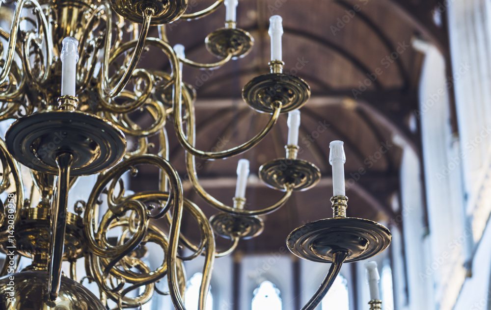 Partial view of an elaborate brass chandelier