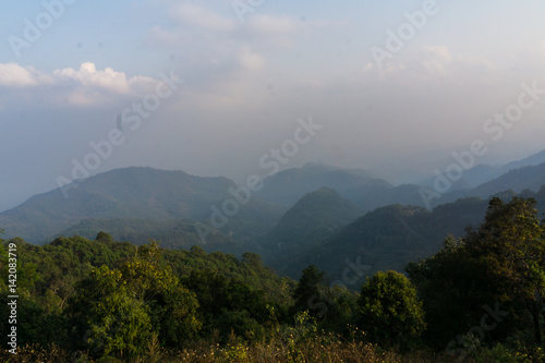 Mountain layer background in evening white cloud