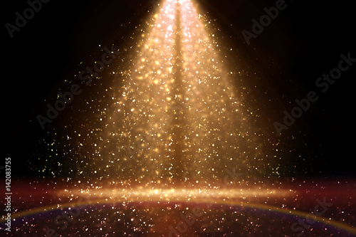 Stage light and golden glitter lights on floor. Abstract gold background for display your product. Spotlight realistic ray photo