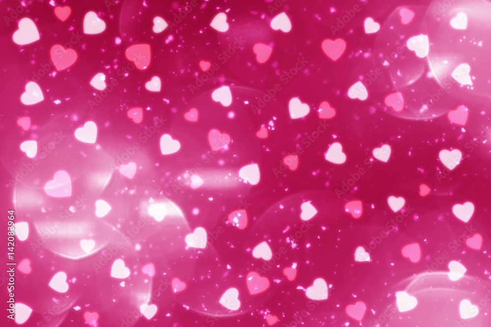 Pink abstract Valentines Day festive background and heart bokeh, glitter or circles lights with hearts. Round  defocused particles