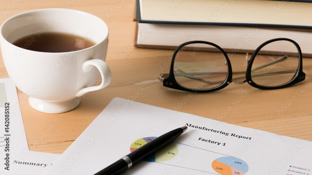 Work desk with bussiness chart and spectacles on wooden desk. Work desk with bussiness chart and spectacles on wooden desk.