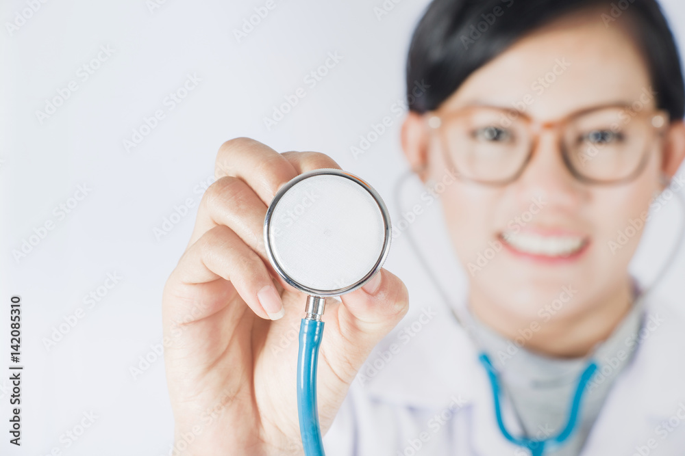 portrait of Asia women doctor on plain background.Focus on Stethoscope Classic Cardiology portrait of Asia women doctor on plain background.Focus on Stethoscope Classic Cardiology