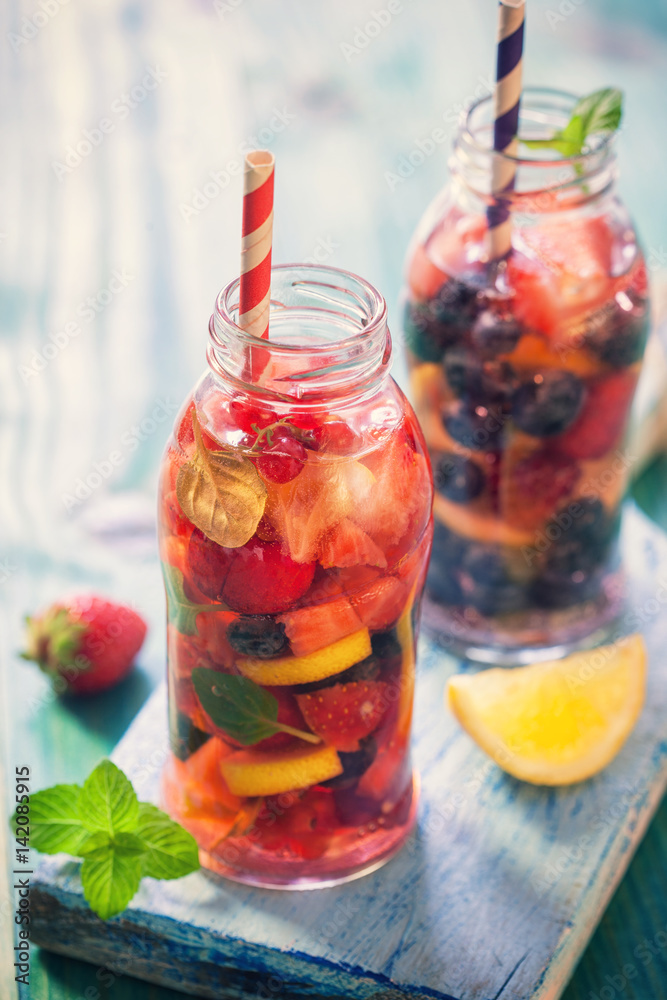 Infused water with fresh berry fruits,lemon, orange and Mint Infused water with fresh berry fruits,lemon, orange and Mint