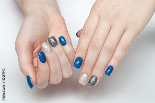  Shiny blue  blue  black  gray  silver manicure on square long nails on a white background a large scale 