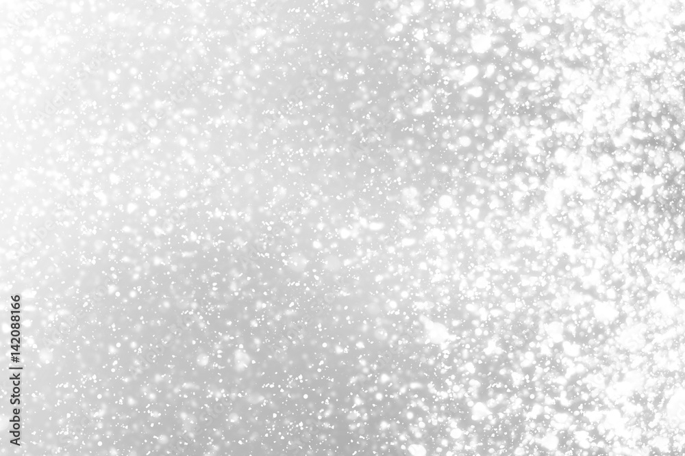 Snowflakes  bokeh or glitter lights festive silver  background. Christmas abstract template