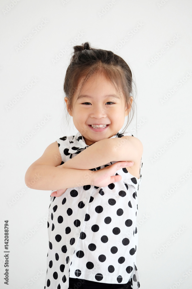 Cute little asian girl smiling in white bedroom background, happy expression emotion Cute little asian girl smiling in white bedroom background, happy expression emotion