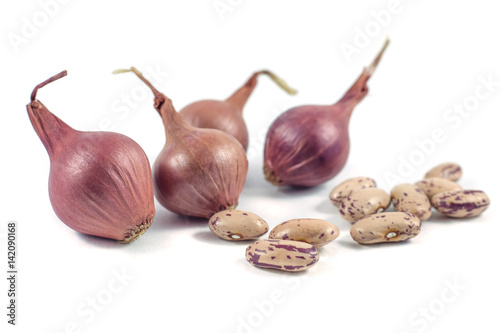 colorful beans and onion isolated on white background