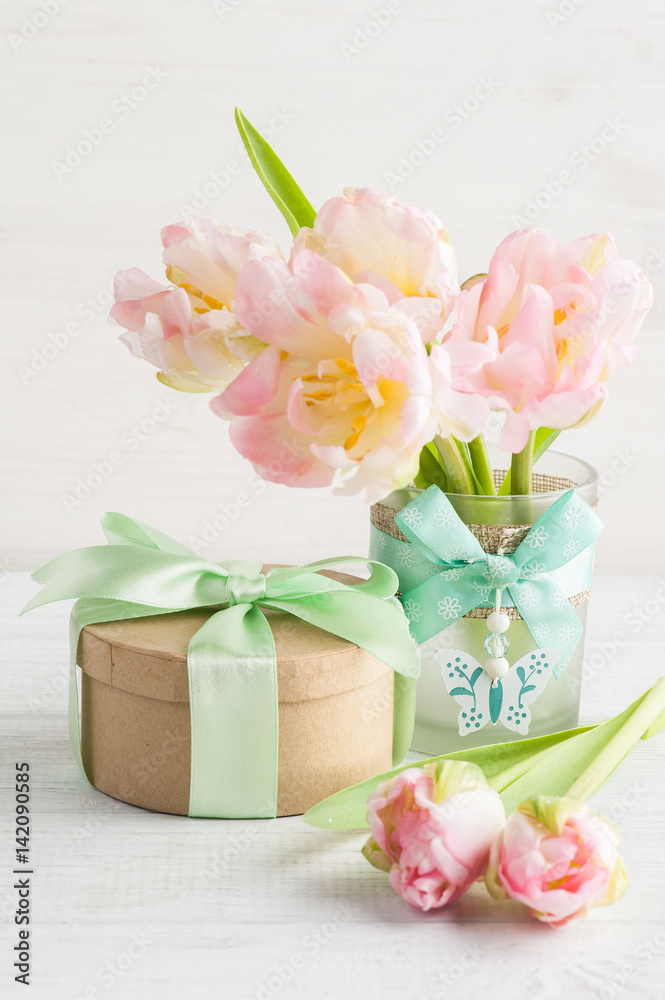 Pink tulips and gift box with green ribbon