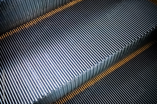 Close up to modern escalator ,Metal escalator step texture