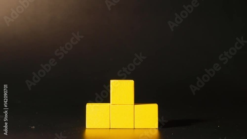 Man's hand picking 3D tetris