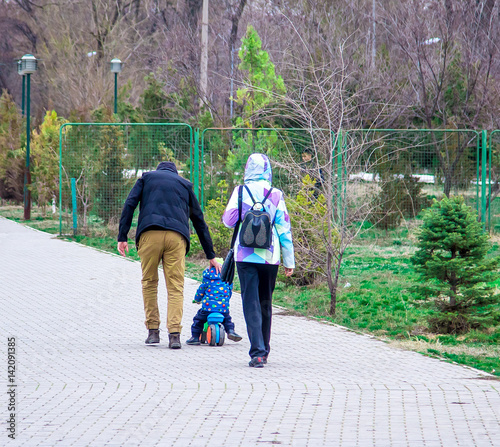 Family with a young son on a bicycle