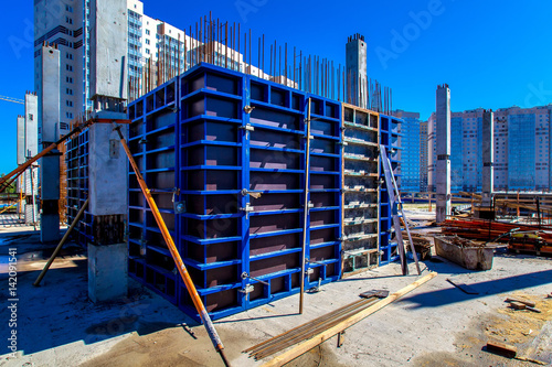 Construction of the building. Pouring concrete into the formwork. photo