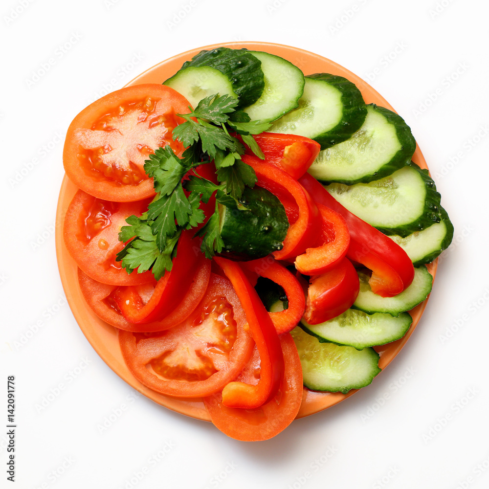 tomato, bell pepper and cucumber slices on plate on white background tomato, bell pepper and cucumber slices on plate on white background