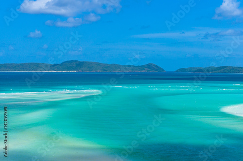 Amazing tropical seascape of turquoise blue water and coral reef islands