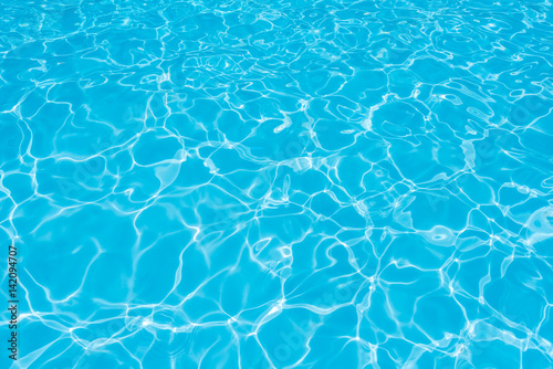 Blue and bright ripple water and surface in swimming pool   Beautiful motion gentle wave in pool