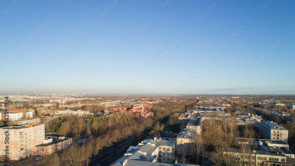 Aerial fly over spring Saint-Petersburg suburb Pushkin town view on streets in sunset