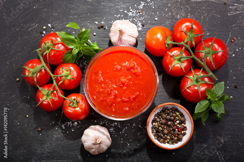 bowl of tomato sauce with fresh vegetables