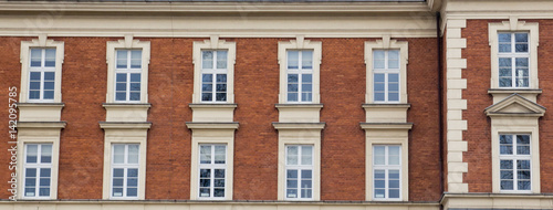 Twelve vintage design windows on the facade of the old house.