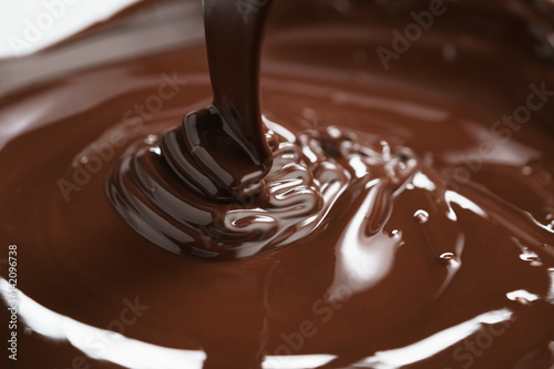 macro photo of premium dark chocolate pour in bowl
