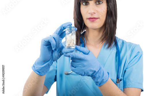 woman doctor with pills in hand