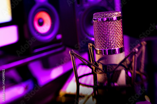 LensBaby tilt shift background, recording studio vintage microphone.