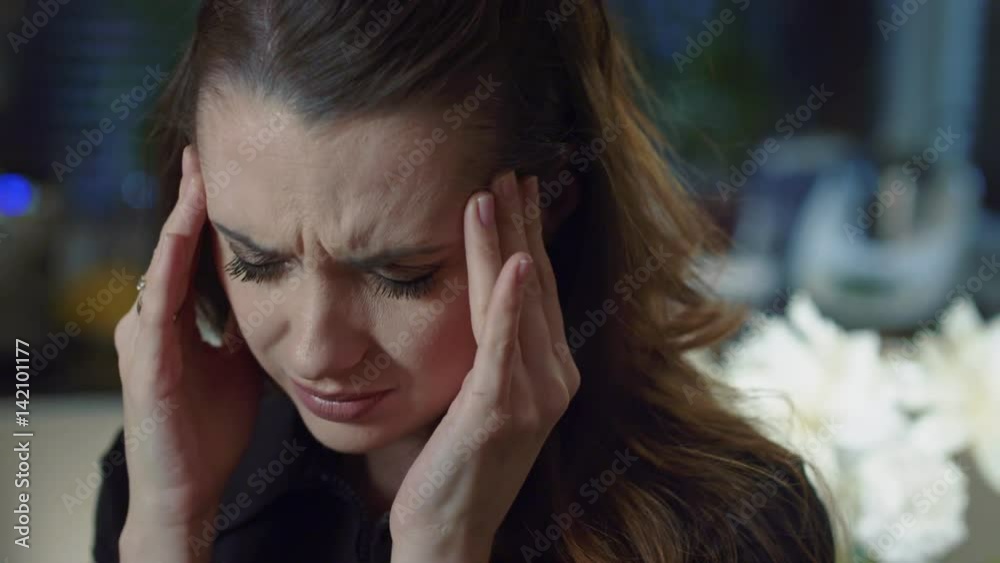 Attractive lady having bad headache at the evening Attractive lady having bad headache at the evening