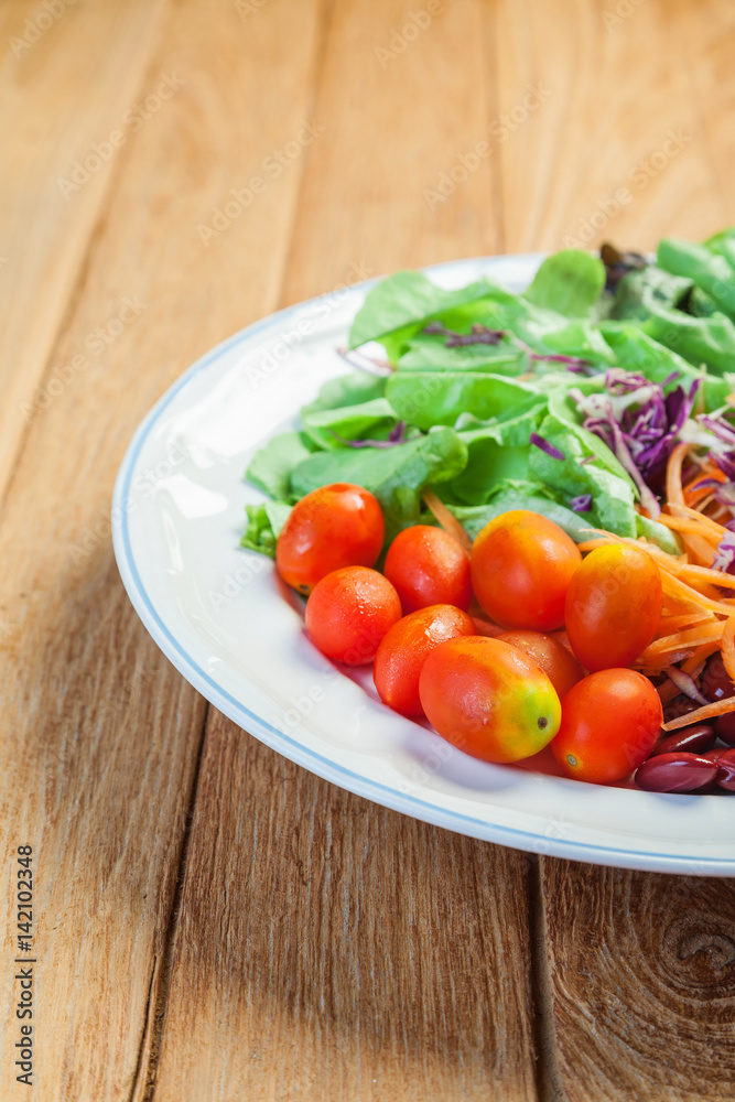 Healthy concept with mixed fruits and vegetables on wooden background