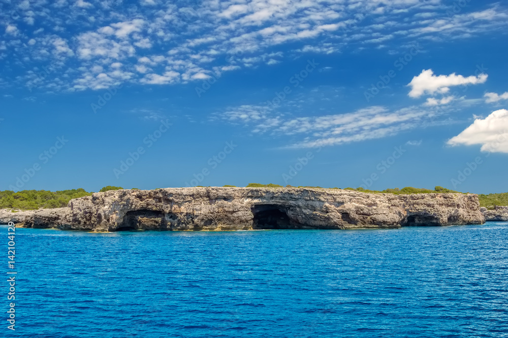 Menorca island south Mediterranean sea coast rock caves.