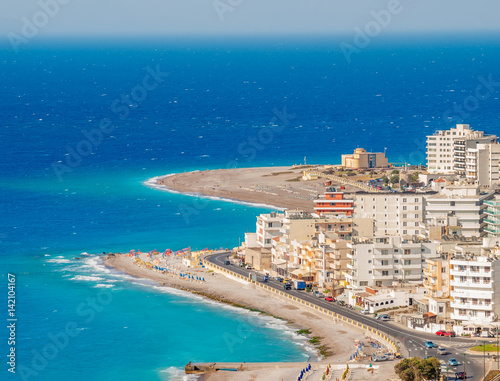Rhodes town tourist district with sand beaches and turquoise Aegean Sea in summer sunny day, Greece.
