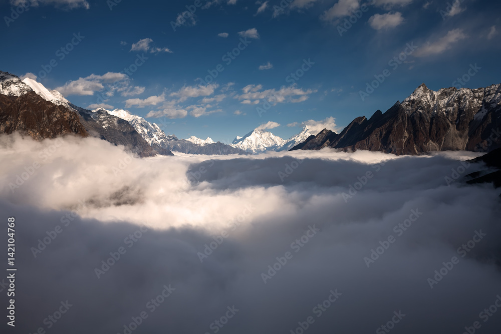 Obraz premium Manaslu valley covered with clouds on Manaslu circuit trek in Nepal