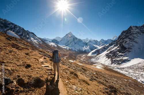 Trekker in Khumbu valley in front of Abadablan mount on a way to Everest Base camp © Maygutyak