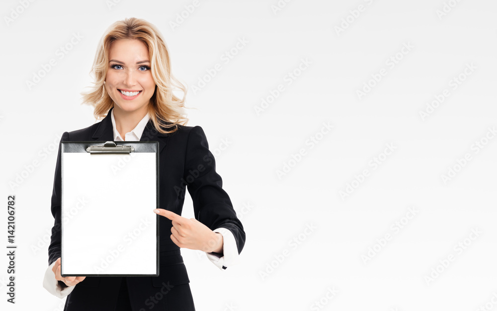 young businesswoman showing blank clipboard young businesswoman showing blank clipboard