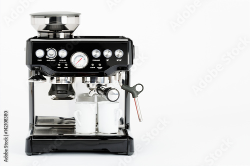 Slika na platnu Isolated black manual coffee maker with coffee mugs on a white background, front