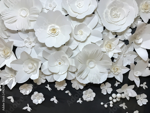 Beautiful Group of Variety Style Handmade Quilling White Floral Pattern with Small Butterfly made from Paper on Black Fabric Wall Background used as Template or Backdrop Interior Vintage Retro Style