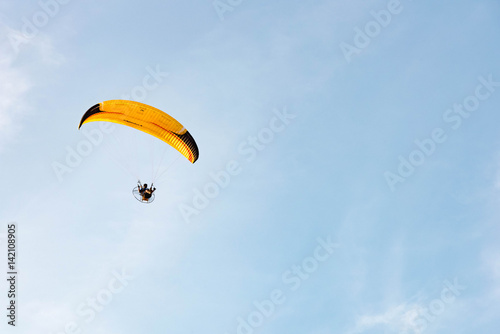 man ride Paramotor flying in the sky