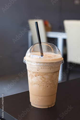 Milk coffee smoothie in plastic cup