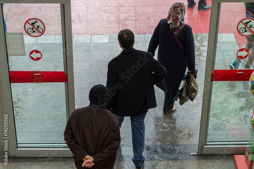 People passing by the automatic door