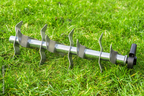 Aerating roller on the grass