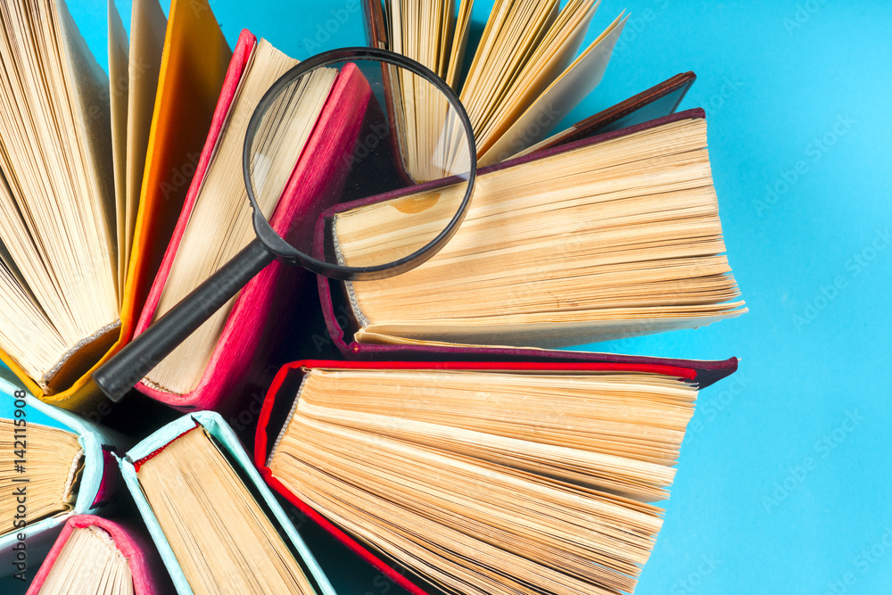 Fototapeta premium Top view of bright colorful hardback books in a circle.